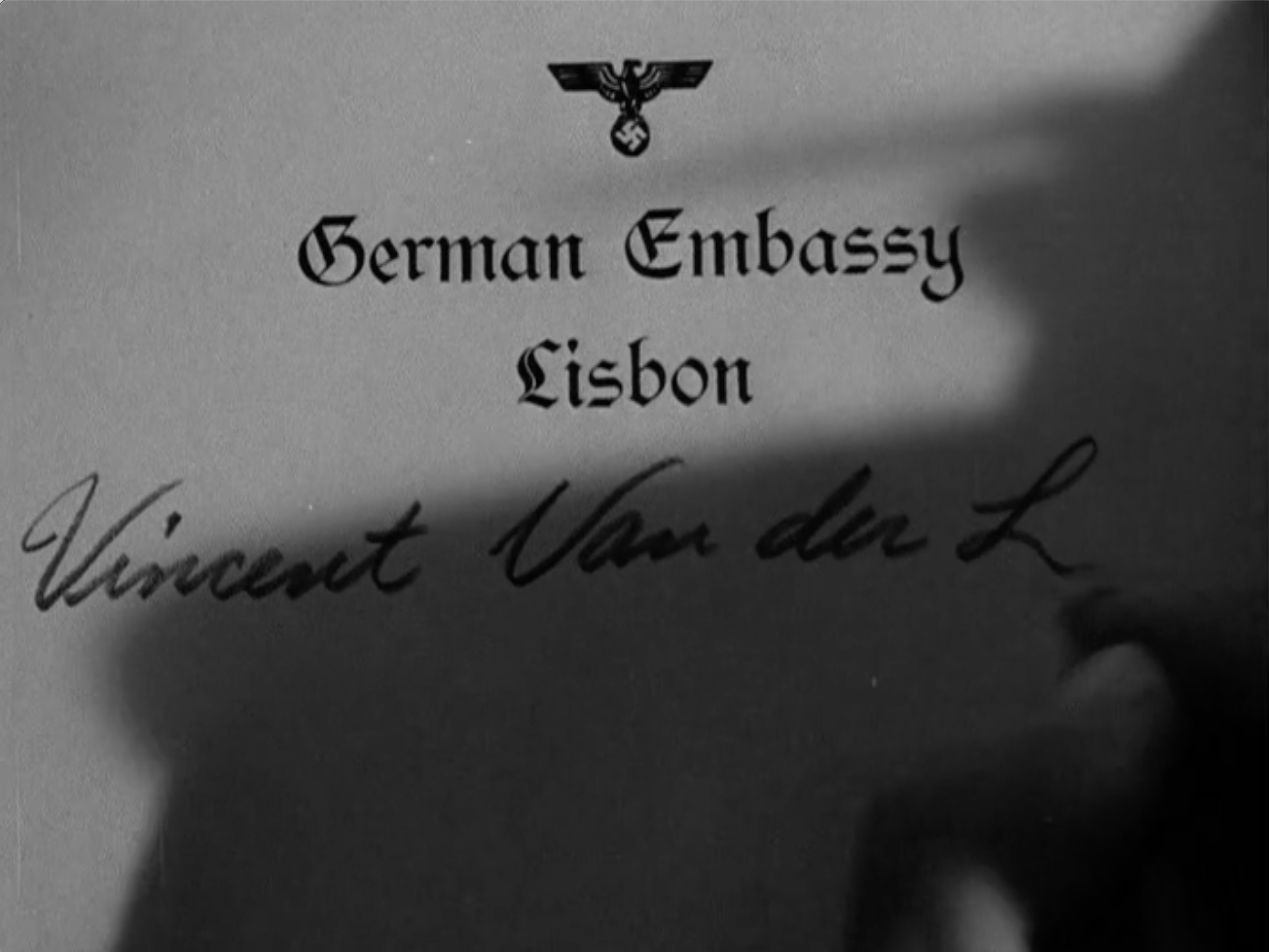 A Nazi writes down a potential spyʼs name